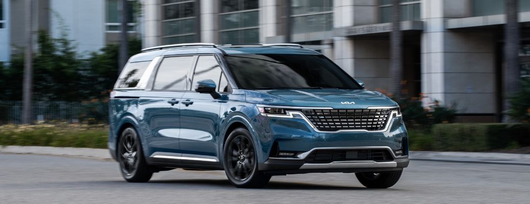 Blue 2022 Kia Carnival MPV side view