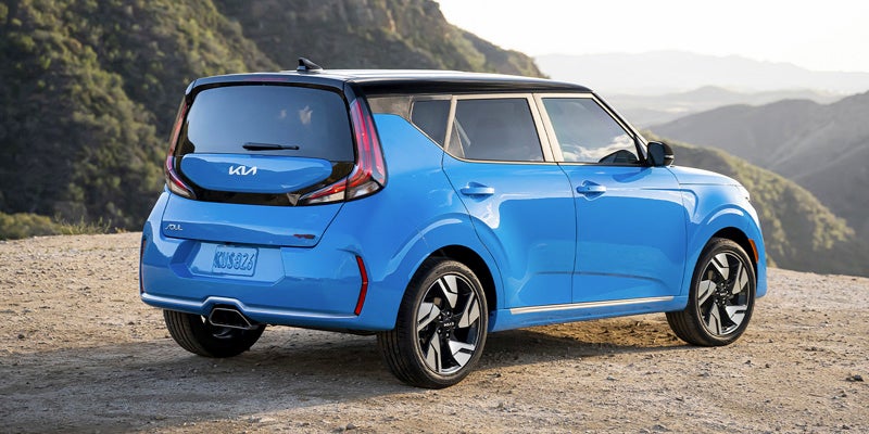 A blue 2023 Kia Soul parked at a scenic lookout near Hayward, CA